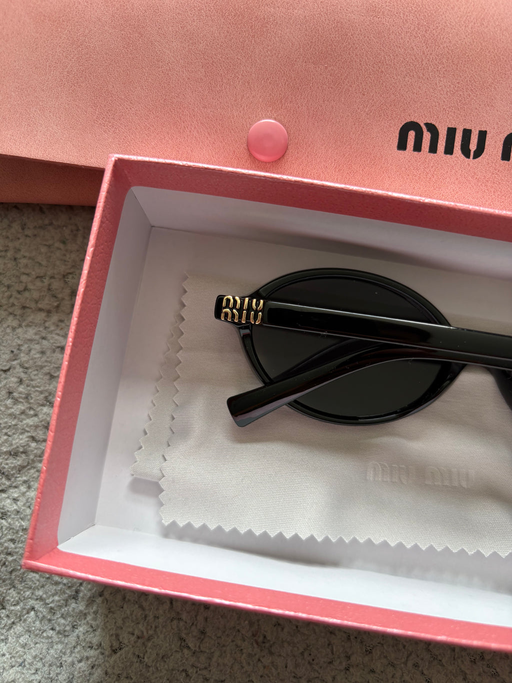 Miu Miu MU 04ZS women’s sunglasses