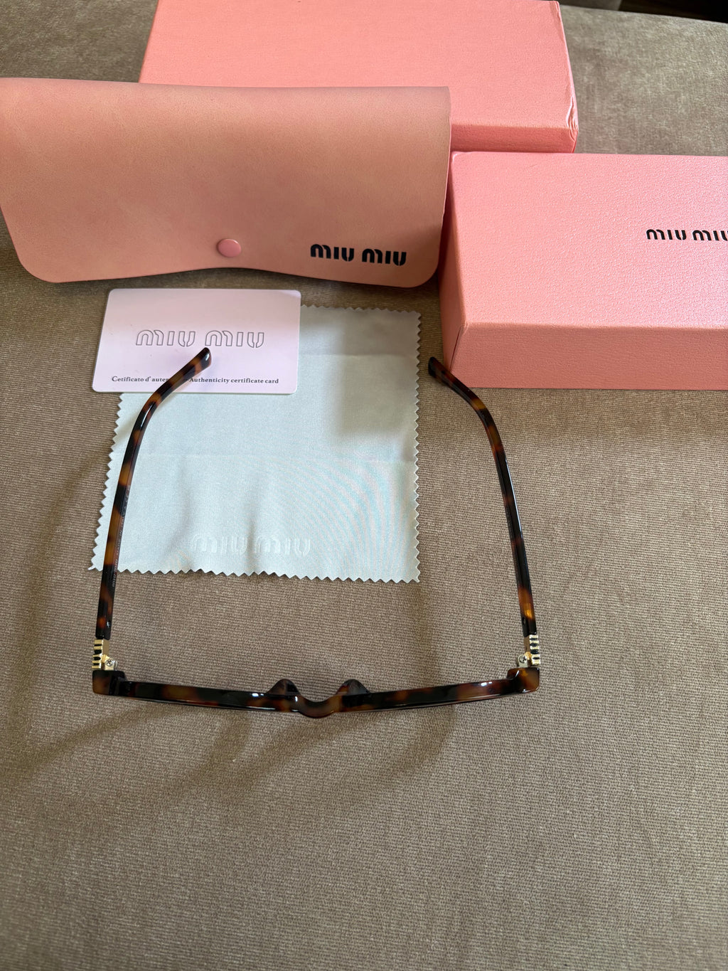 Miu Miu MU 04ZS women’s sunglasses