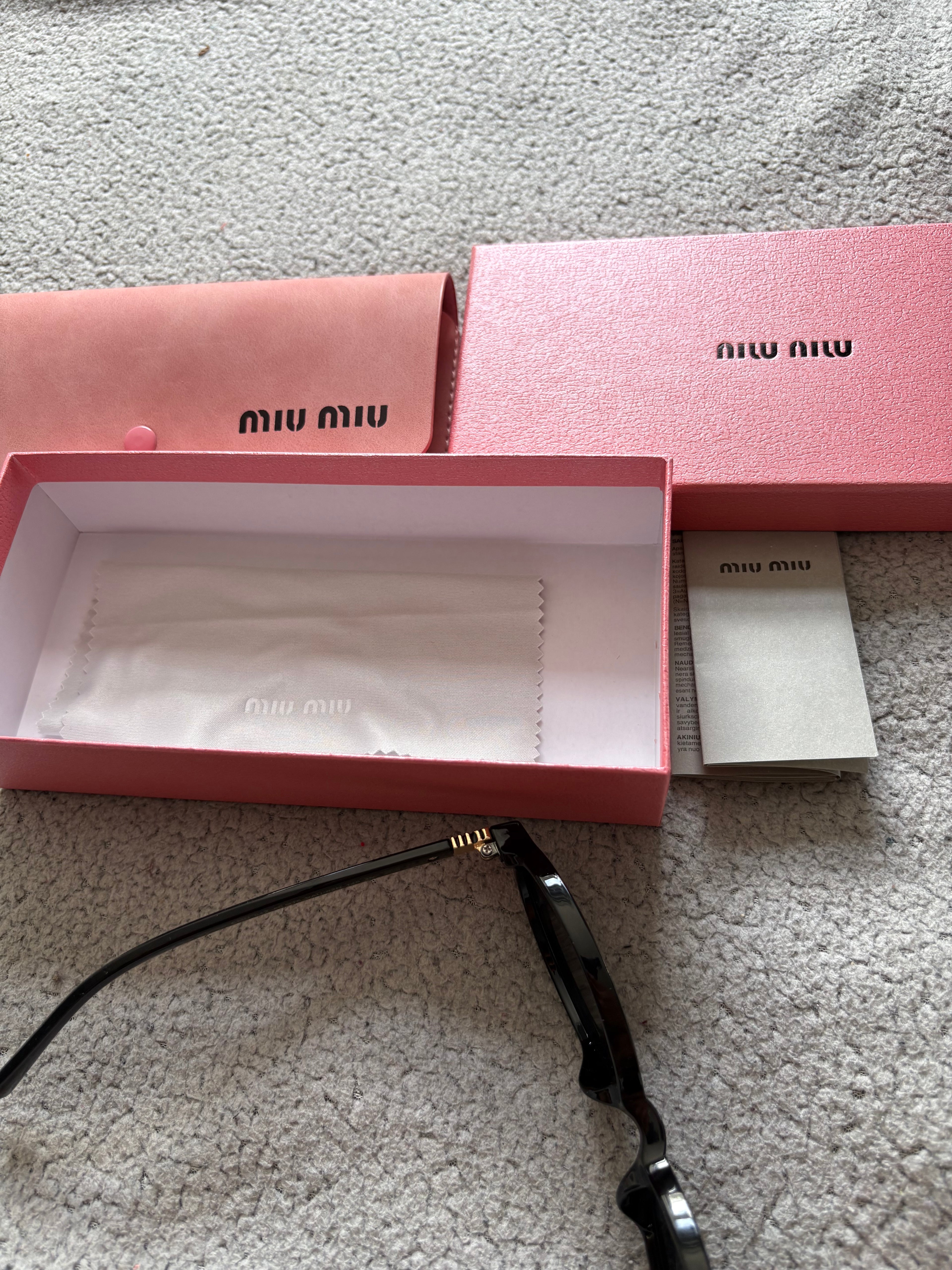 Miu Miu MU 04ZS women’s sunglasses