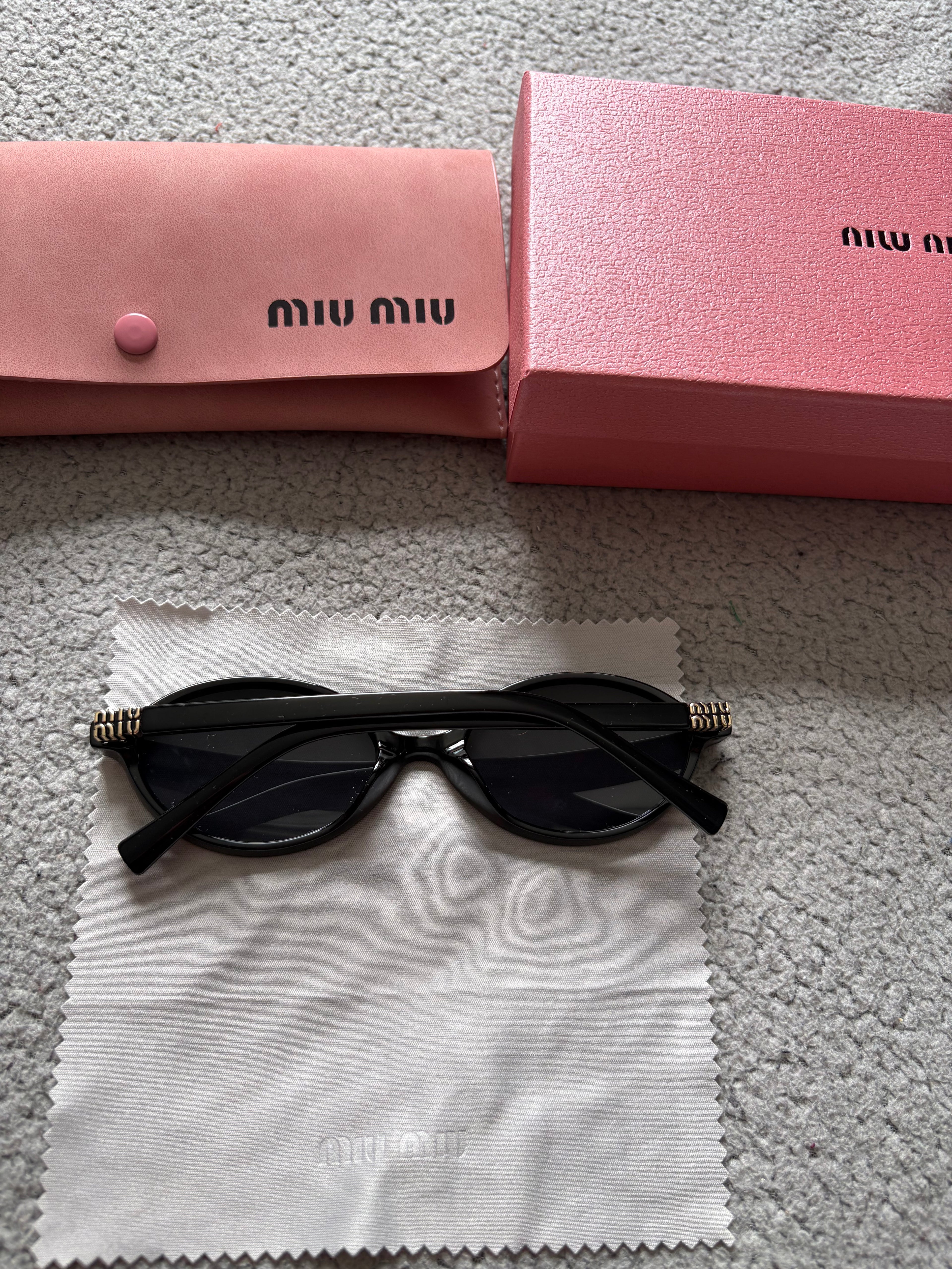 Miu Miu MU 04ZS women’s sunglasses