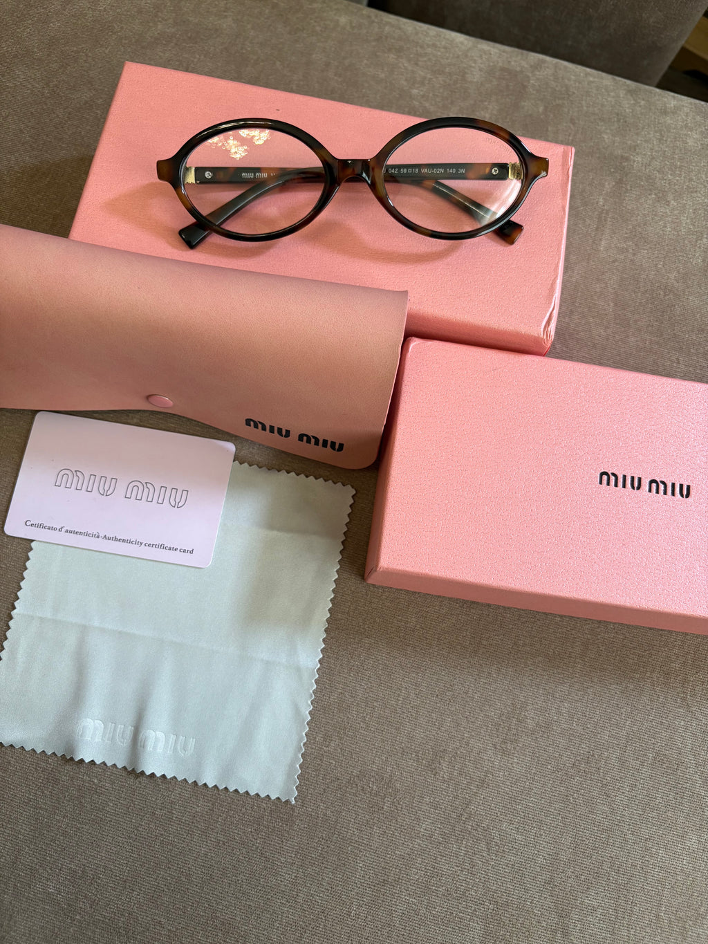 Miu Miu MU 04ZS women’s sunglasses