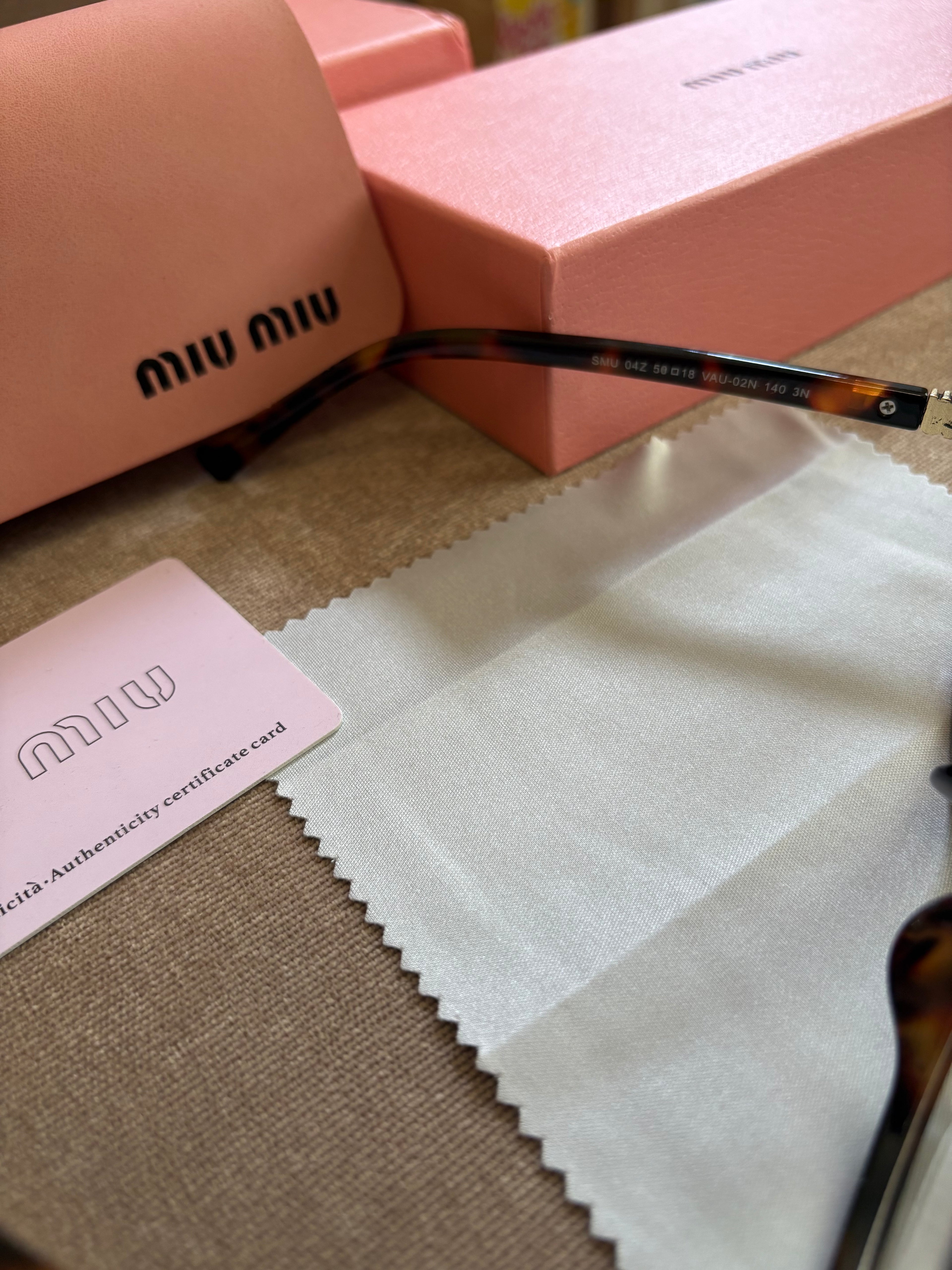 Miu Miu MU 04ZS women’s sunglasses